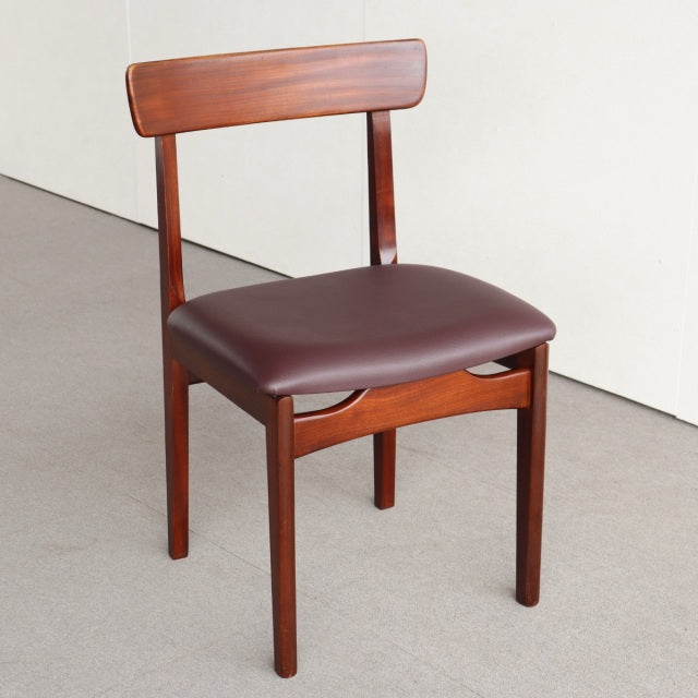 Vintage teak dining chair by Younger with smooth wood grain, curved backrest, and padded brown leather seat in mid-century.