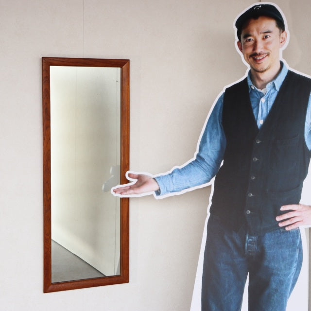 Mid-century British vintage teak wall mirror with rectangular frame showcasing rich wood grain and clean lines.