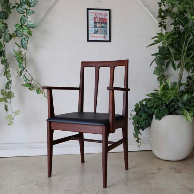 Vintage teak dining chair by Younger with armrests, British mid-century design by John Herbert, sleek vertical slatted back.