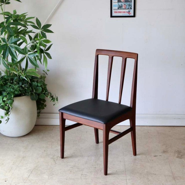 Vintage teak dining chair by Younger with slender tapered legs, mid-century British design, black upholstered seat, vertical .