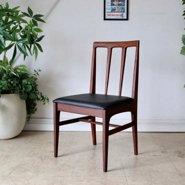 Vintage teak dining chair by Younger, British mid-century design with tapered legs and black leather seat cushion.