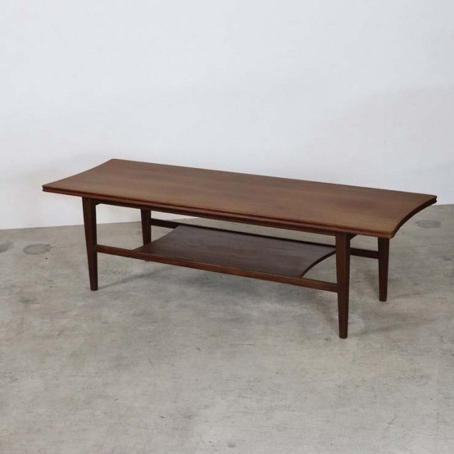 Vintage British mid-century teak coffee table by Richard Hornby with magazine rack and tapered legs.