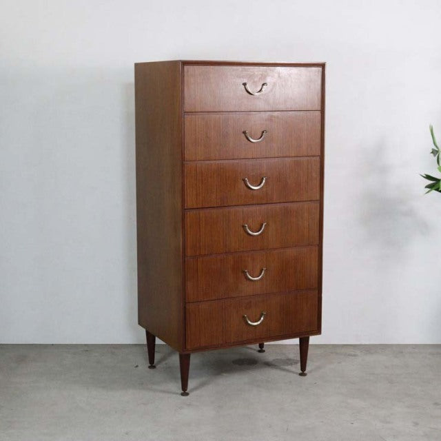Vintage mid-century teak chest of six drawers with tapered legs, British design by Meredew, smooth wood grain finish.