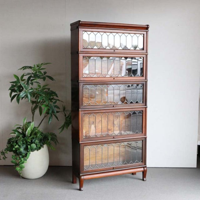 Vintage British Globe Wernicke glass bookcase in rich teak with mid-century design, five tiered glass-paned sections and.