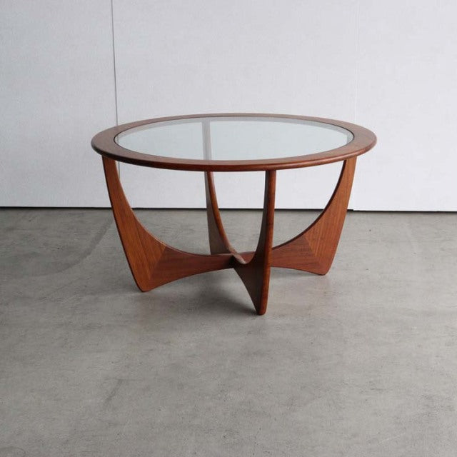 Mid-century British vintage teak coffee table with round glass top and sculptural triangular base from G-Plan.