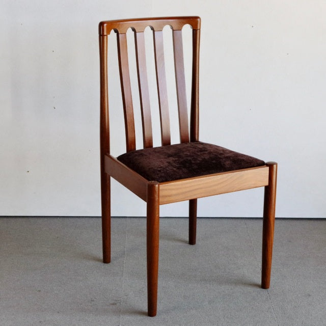 Mid-century British Meredew teak dining chair with vertical slat back and dark brown upholstered seat.