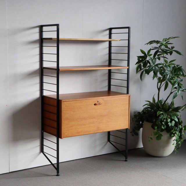 Vintage mid-century Ladderax shelving unit by Staples, teak wood shelves with rich grain, slender black iron frame,.