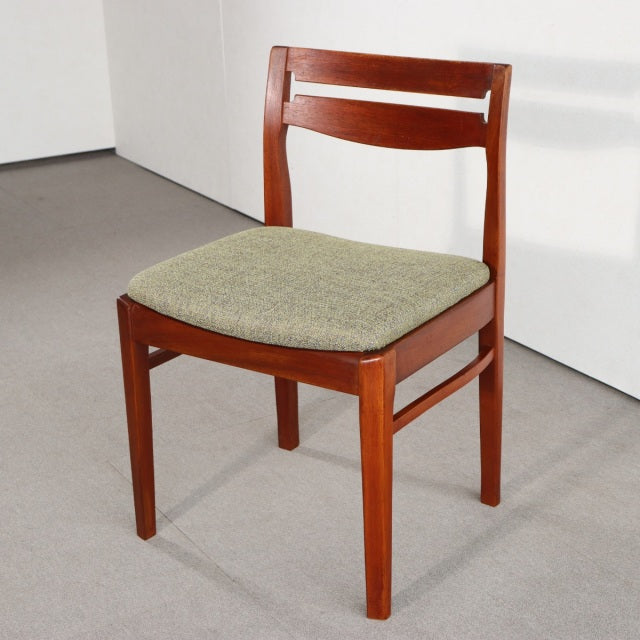 Vintage mid-century teak dining chair by NATHAN with British-Denmark design, olive green upholstered seat, visible wood.