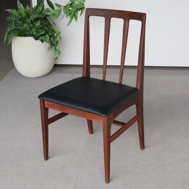 Mid-century British dining chair by Younger FONSECA with vintage teak frame and black vinyl seat upholstery.