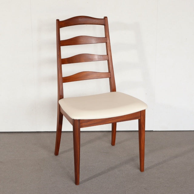 Vintage G-PLAN teak dining chair with mid-century British design, ladder-back and cream upholstered seat.
