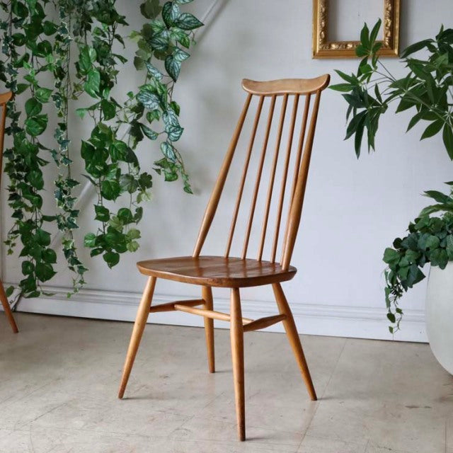 Vintage British Ercol Goldsmith dining chair in teak with slender spindle back and tapered legs, mid-century design.