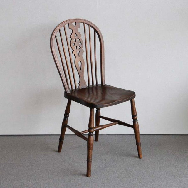 Vintage British mid-century teak kitchen chair with spindle back and decorative central splat, tapered legs with stretchers, .