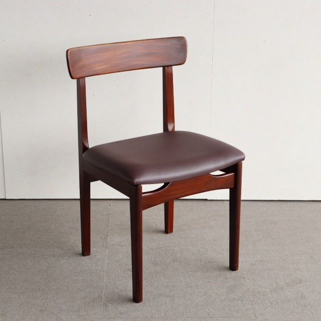 Vintage mid-century teak dining chair by Younger with curved backrest and dark brown upholstered seat, sleek tapered legs.