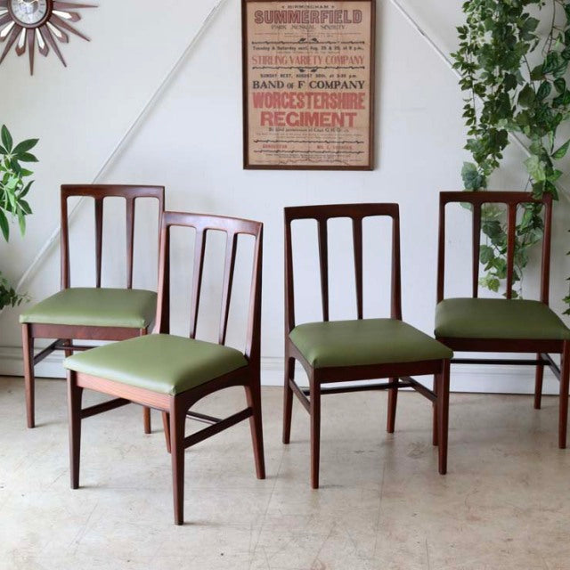 Set of four vintage teak dining chairs by A.Younger Ltd., British mid-century design with green upholstered seats and.