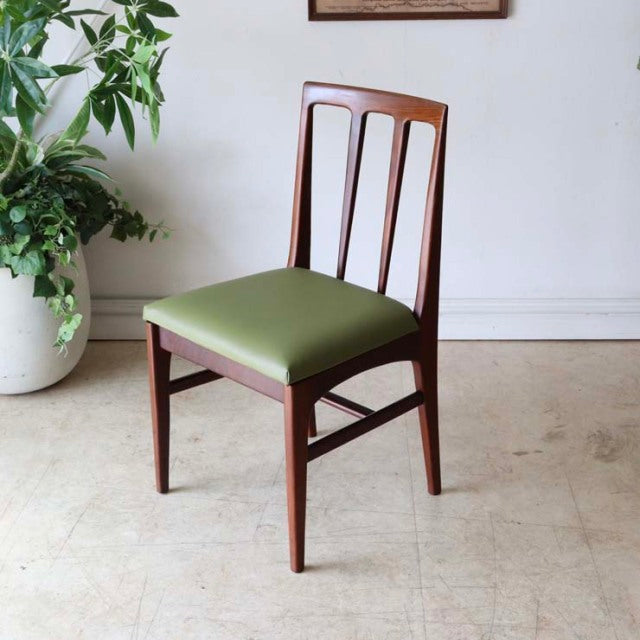 Mid-century British vintage teak dining chair by A.Younger Ltd. with vertical slat back and green upholstered seat.