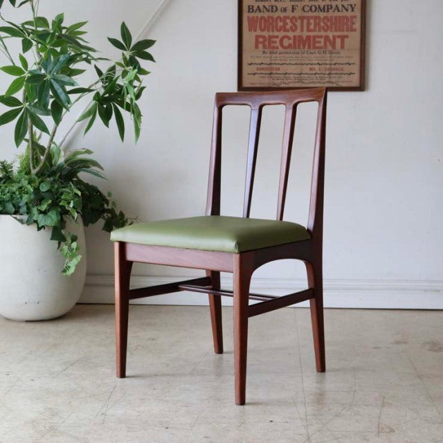 Vintage mid-century teak dining chair by A.Younger Ltd., British design with green upholstered seat and sleek wood grain.