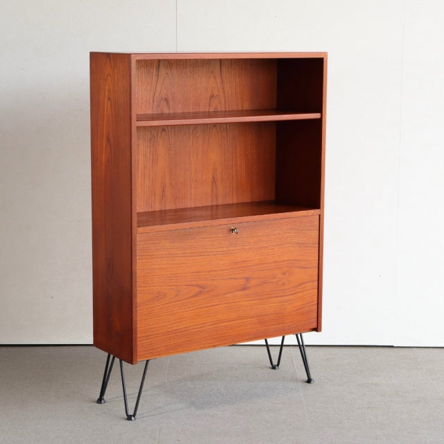 Mid-century vintage teak cabinet from Denmark with iron hairpin legs and rich wood grain detailing.